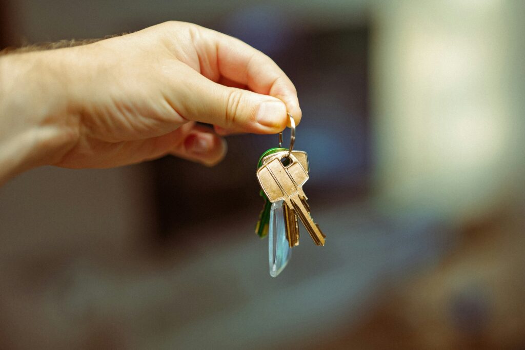 A landlord handing over a set of house keys